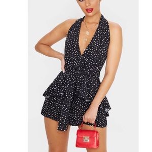 Monochrome polka dot halter neck romper.